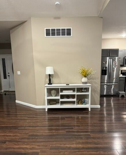 White console table moved to a different wall in our living room